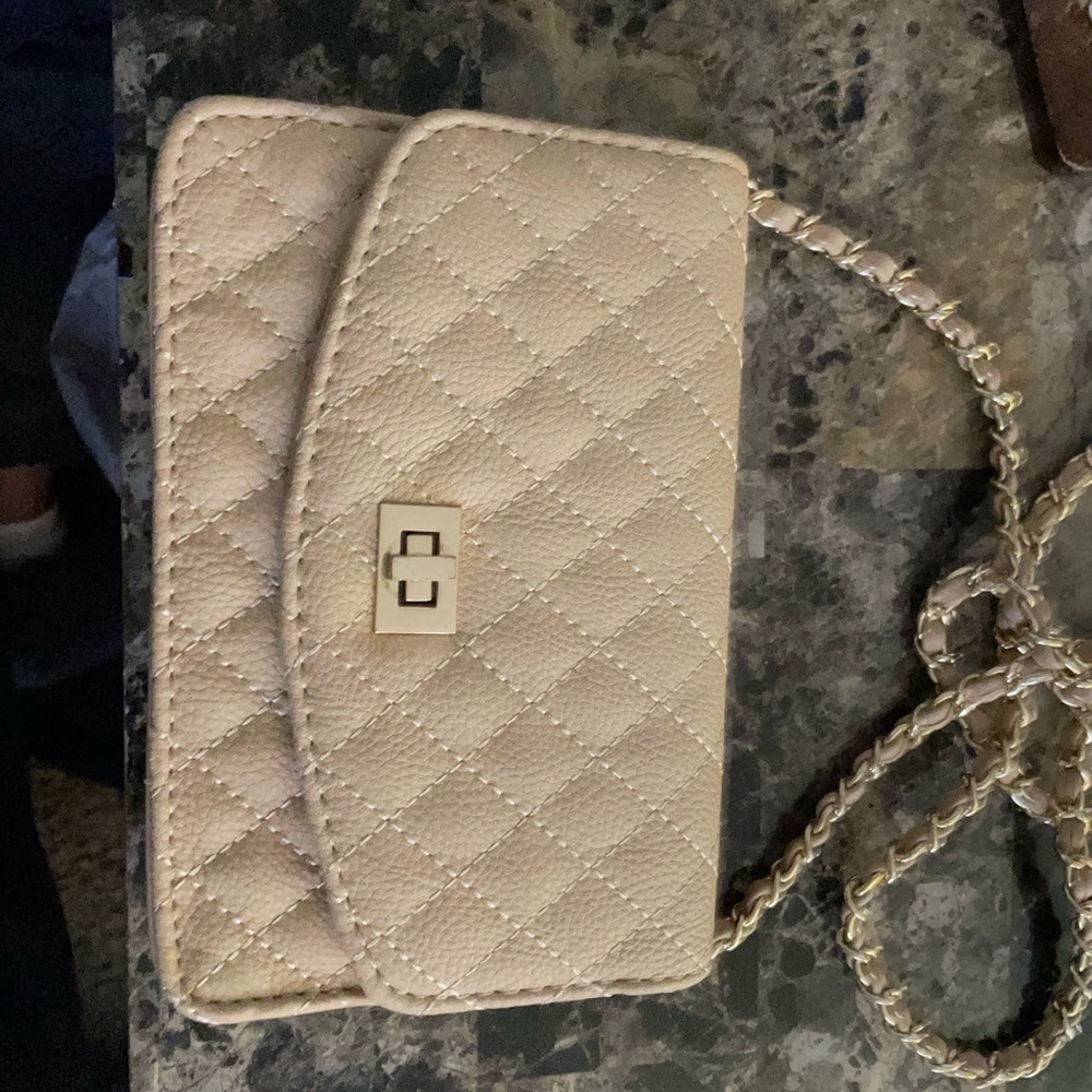 Pretty nude color crossbody bag.